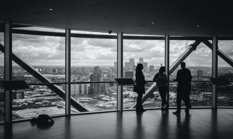 A group of individuals standing in an open floor.